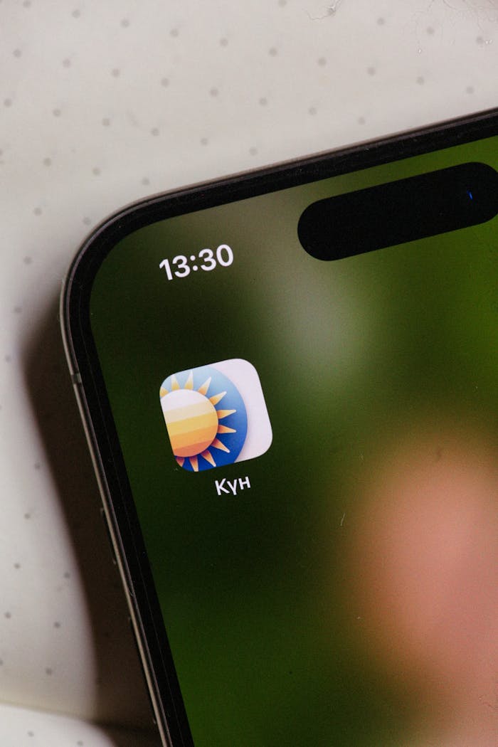 A close view of a weather app icon on a smartphone screen.